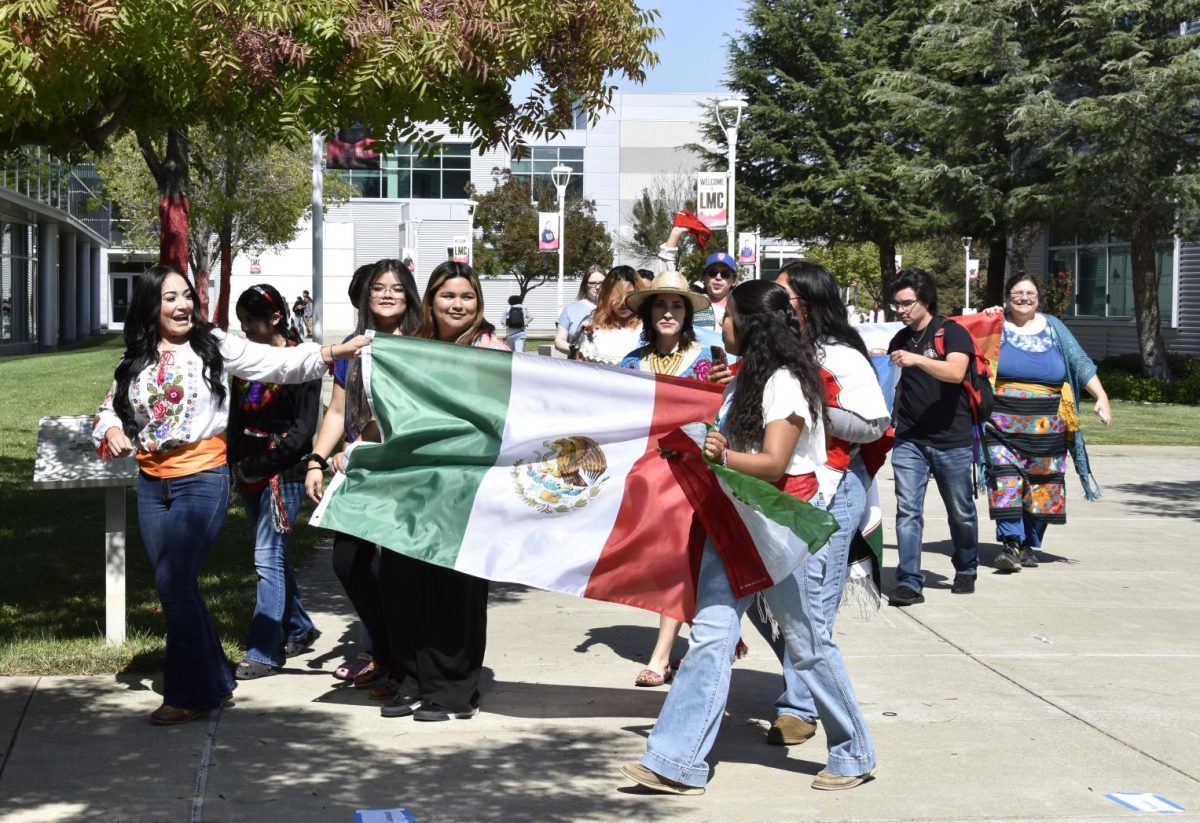 Students and faculty walking across campus to represent their flags, Sept. 17.