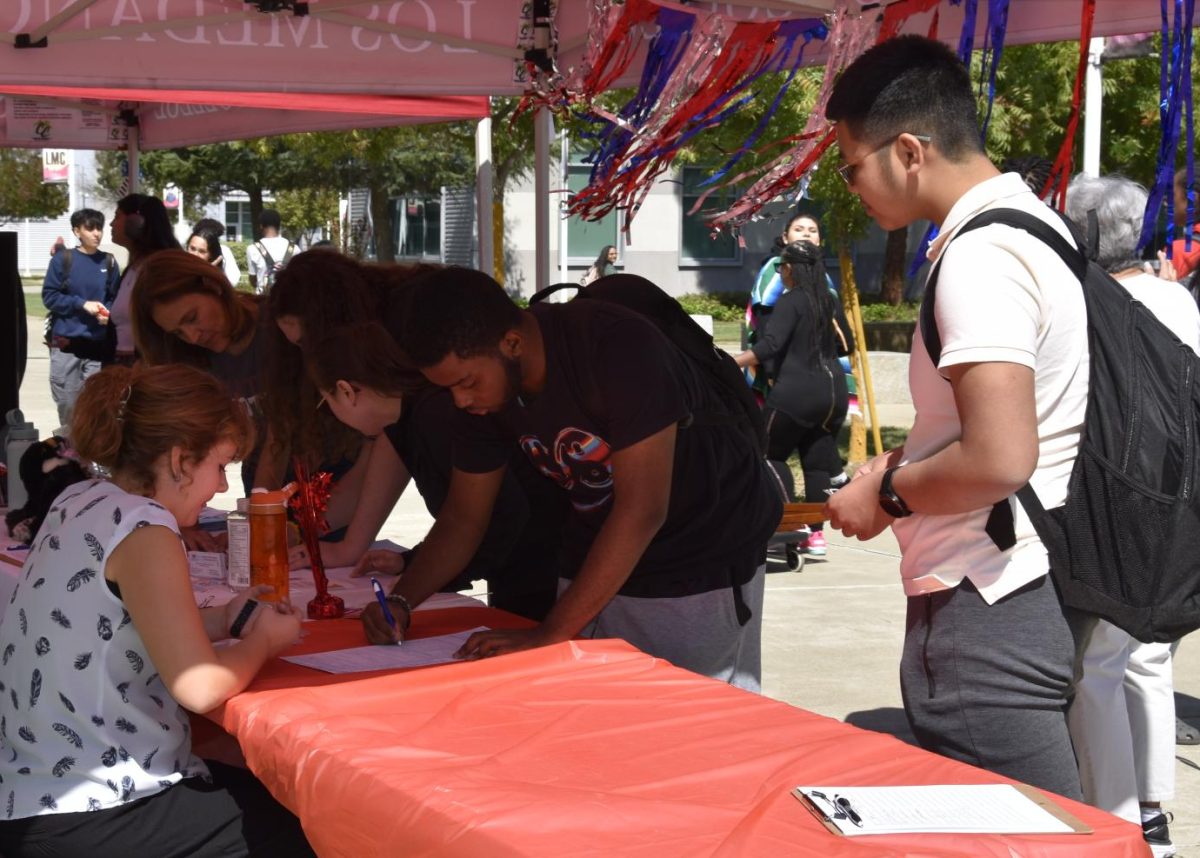 Students registering to vote with the League of Women Voters on Pittsburg campus, Sept. 17