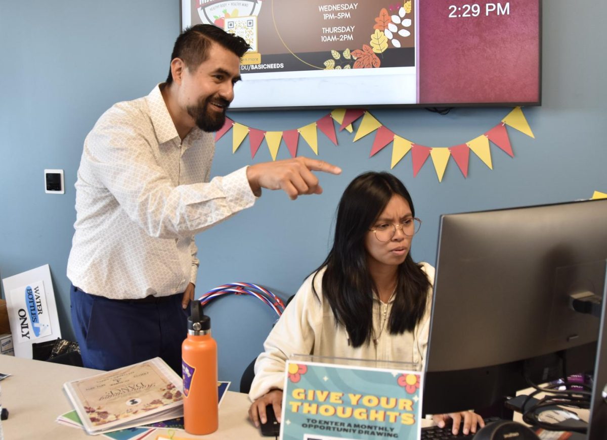 Robert Delgado helping Student Ambassador Kat Pangilinan.