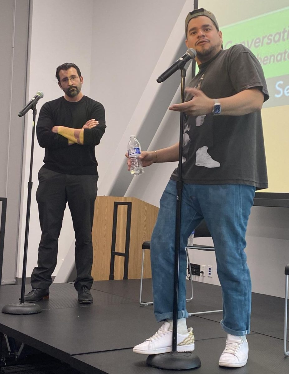 Nick Garcia (left) and Brian Quijada (right) speak to a crowd in the Student Union Conference Room Sept. 23.