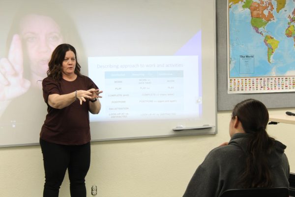 LMC professor Jennifer Finnigan lectures during her American Sign Language class.