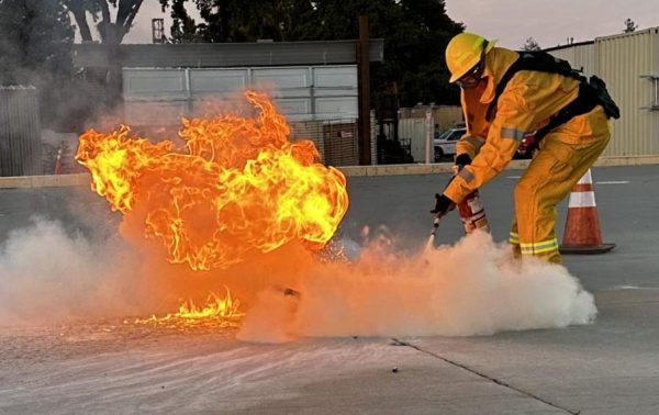 Los Medanos College Fire Academy student Tristian Otis puts out a fire in a demonstration of how to use a fire extinguisher.