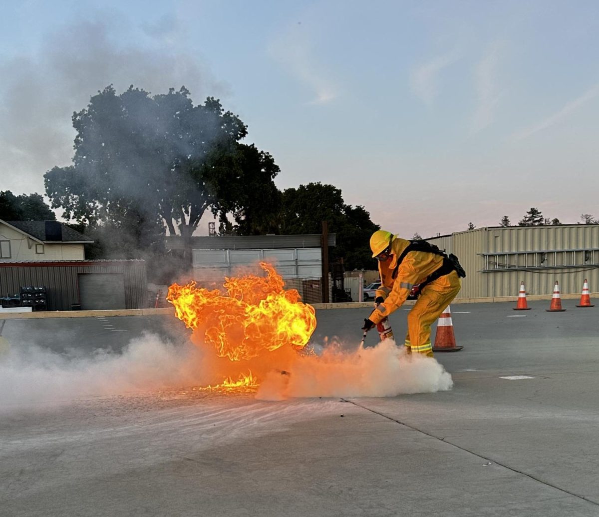 Los Medanos College Fire Academy student Tristian Otis puts out a fire in a demonstration of how to use a fire extinguisher.