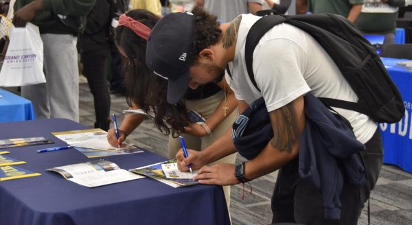 Student visits UC Merced table at Los Medanos College’s annual Transfer and Opportunity fair held in Student Union Conference Center Oct. 22.