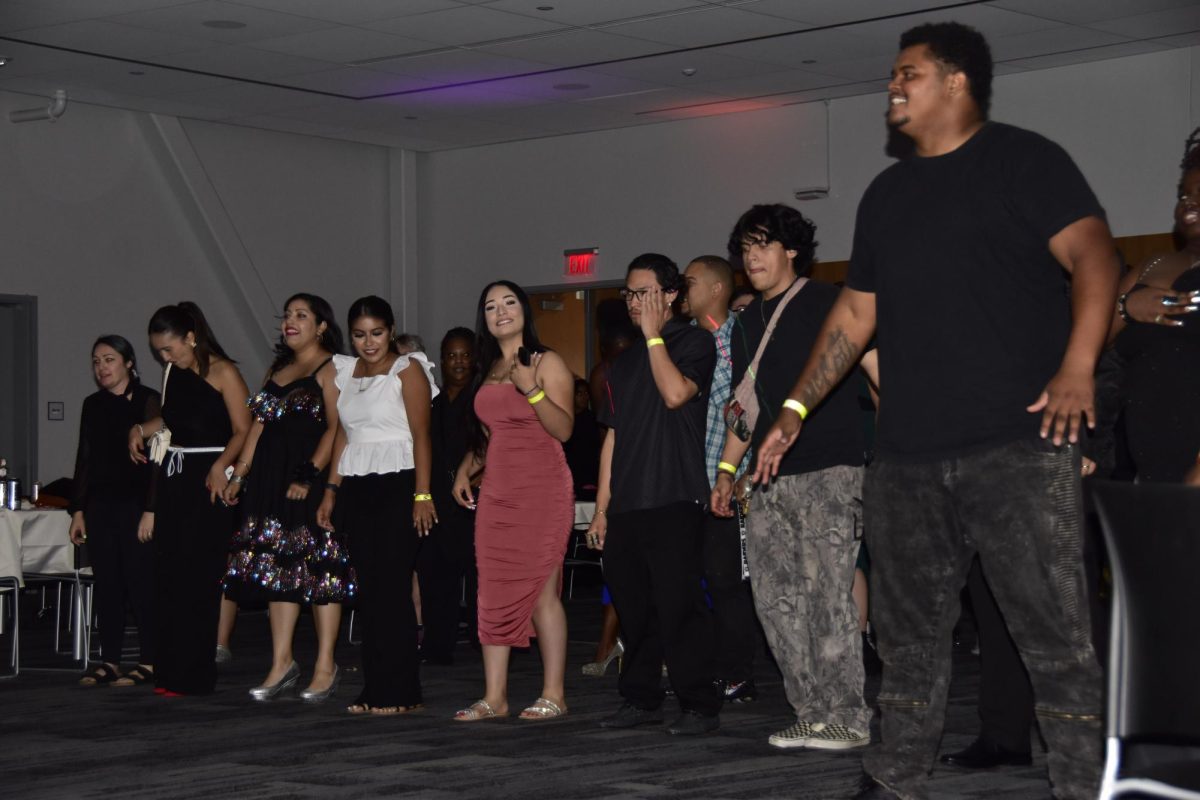 Students dance to the music at the "Bridgerton" theme Homecoming Dance in the Student Union, Oct. 4. 