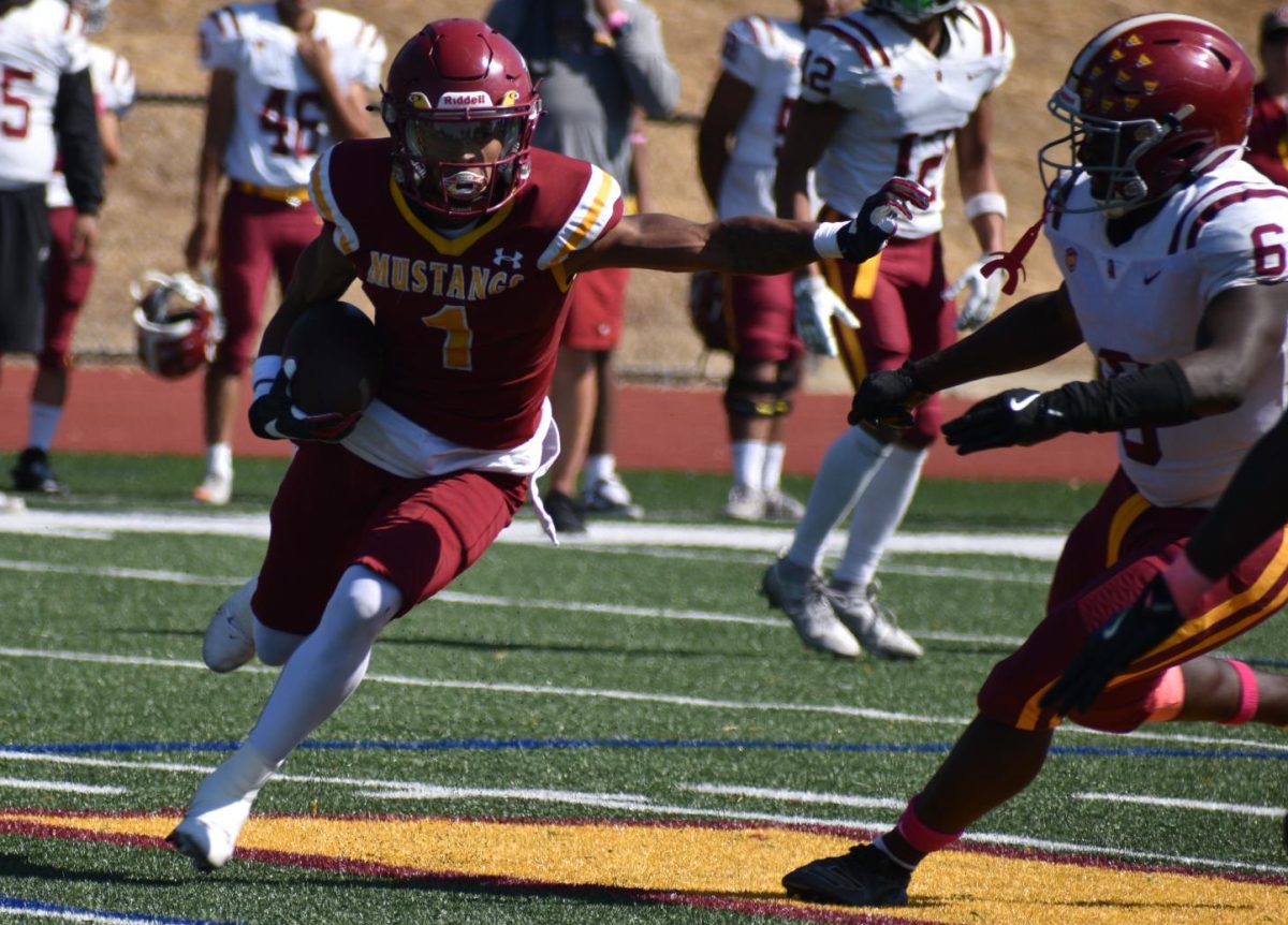 Mustang's receiver Marques Singleton Jr tries to fend off De Anza linebacker Hosea Addison in LMC's home, Oct. 5.