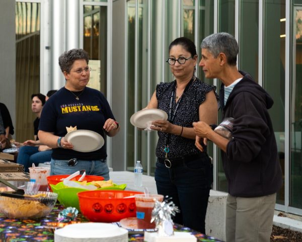 LMC staff members Katie Berryhill, Jen Saito, and Jancy Rickman gather at the event for food. 