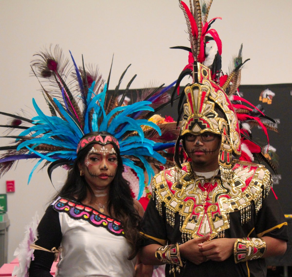 Puente students Stephanie Cuevas and Juan Pablo stand for the Dia De Los Muertos event at the Student Union Conference Room, Oct. 29.