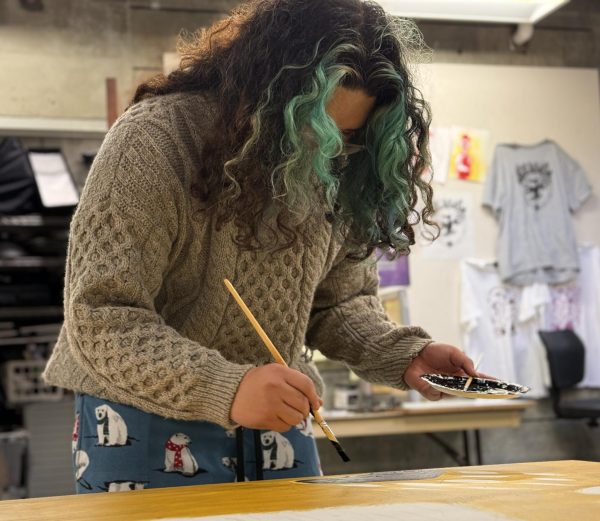 LMC art student Colin Magwili helps paint mural to honor indigenous tribes in the Bay Area.