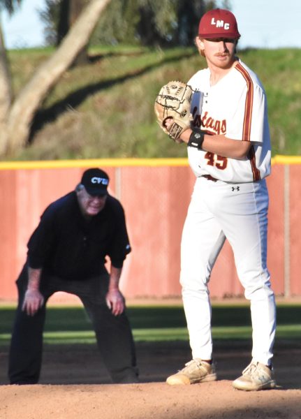 Pitcher Shawn McBroom sets up for the game's final inning.