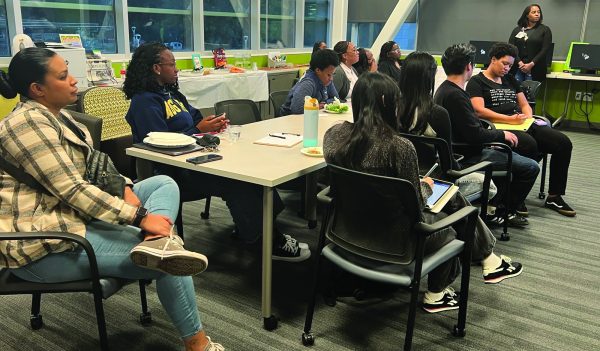 Photo courtesy Megela Ohare 
Attendees of the Black Caucus listen to presentation.