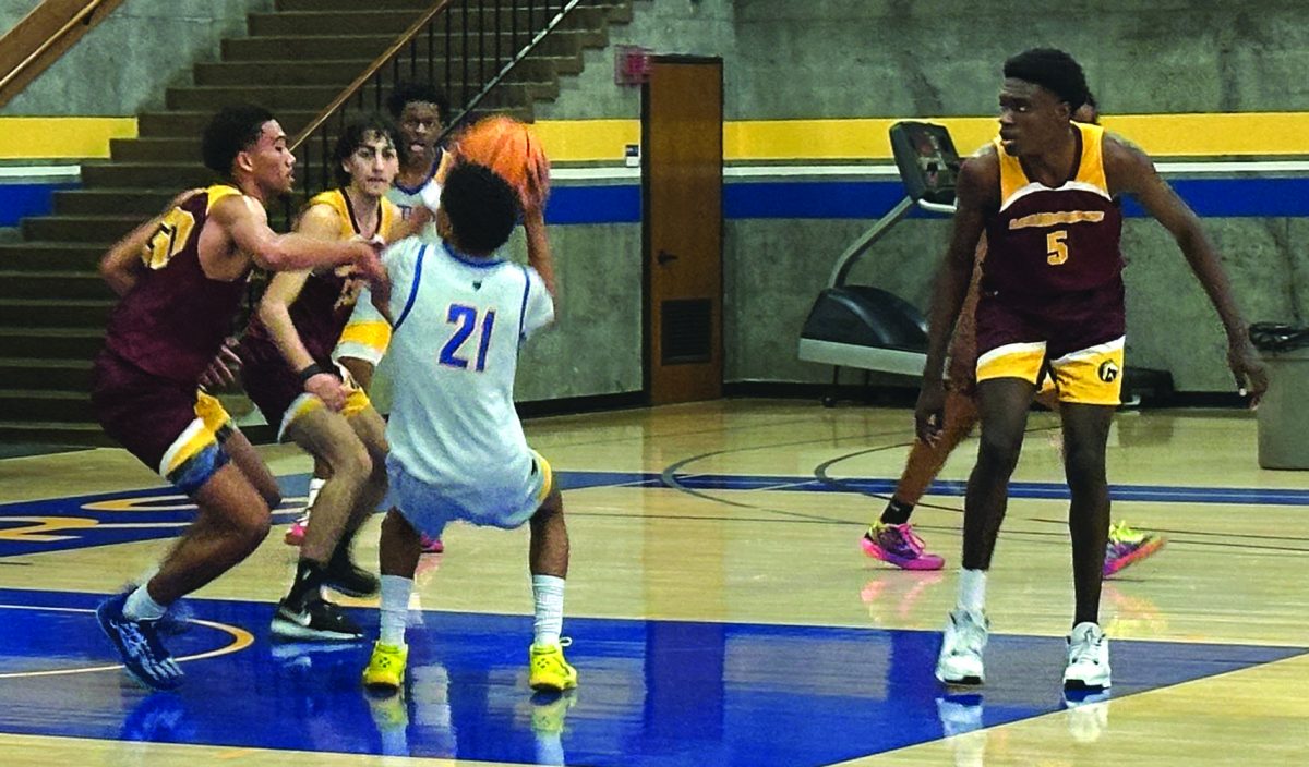 Alicia Johnson • Experience
No. 21 Eric Watson shoots for a contested layup in the third quarter.