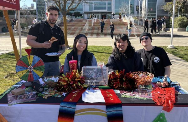 Puente students set up their table for Mustang Day on Pittsburg campus, Jan. 28.