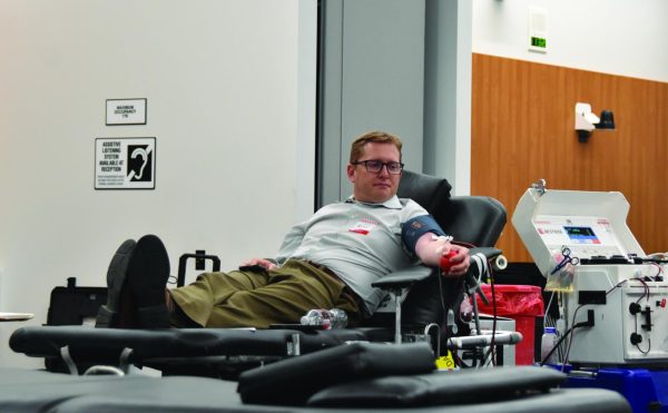 Senior Dean of Planning Ryan Pedersen gets his blood drawn at Blood Drive in the Pittsburg Conference Room, March 12.