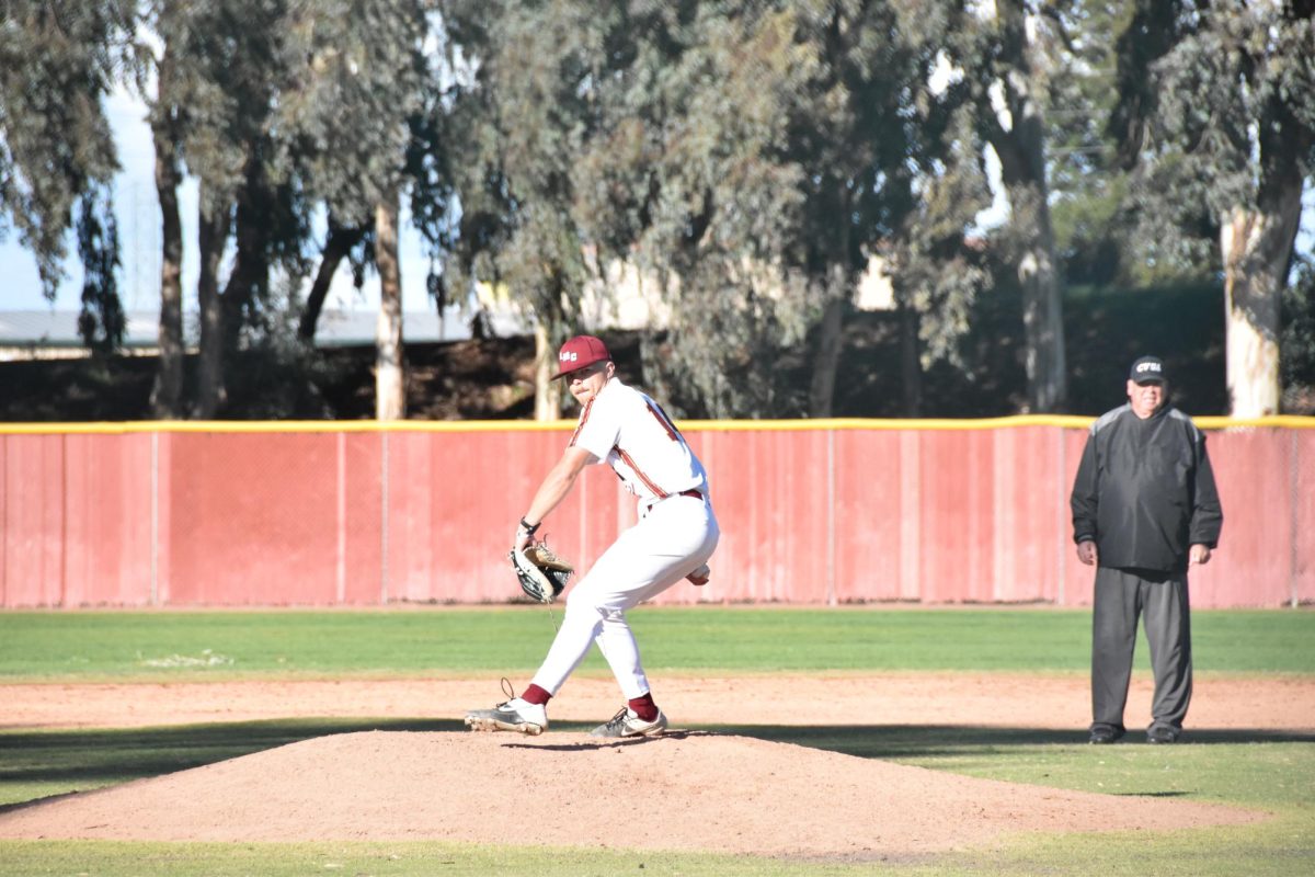 Ryder Oakley winds up for a pitch in the ninth inning.