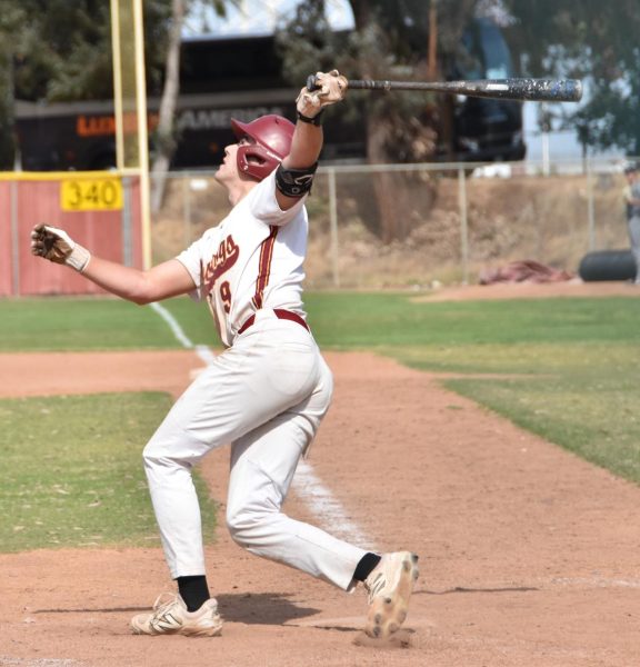 No. 9 infielder Charlie Malton pops a fly ball into left field in Tuesday's game agaisnt Yuba at home game, April 15.