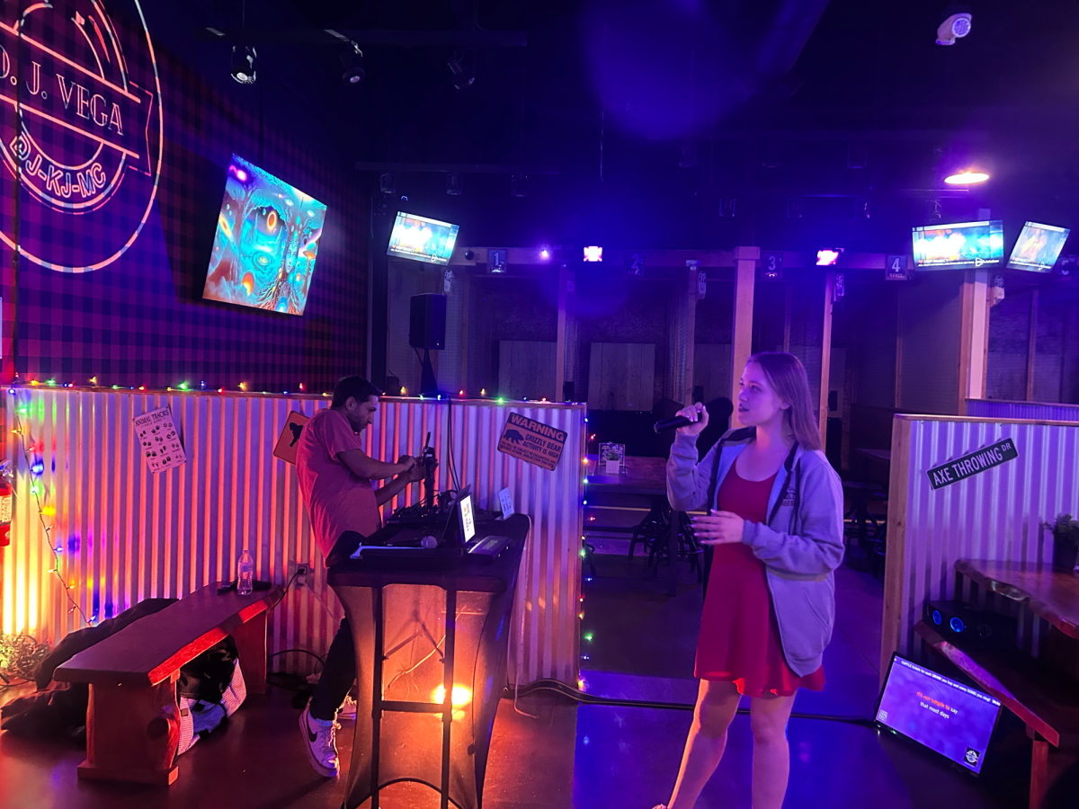 Kirsten Shahan sings karaoke at the WTF bar.