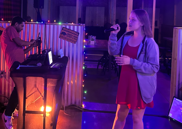 Kirsten Shahan sings karaoke at the WTF bar.
