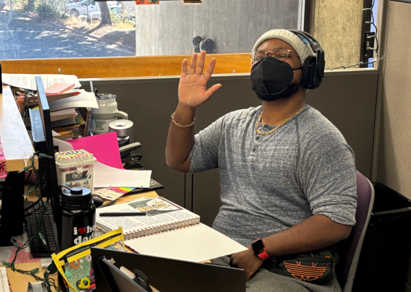 English department assistant and bookstore employee Sketch Choice's personality shines even while masked.