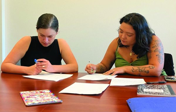 Rachel Rios and Kali Canedo participates in a "Let's Get Lit" workshop and create a poem together.