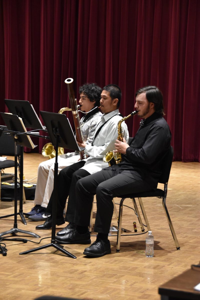 Jacob Chatham, Omar Cabada, and Jin Christian Rimando perform at end-of-semester concert. 