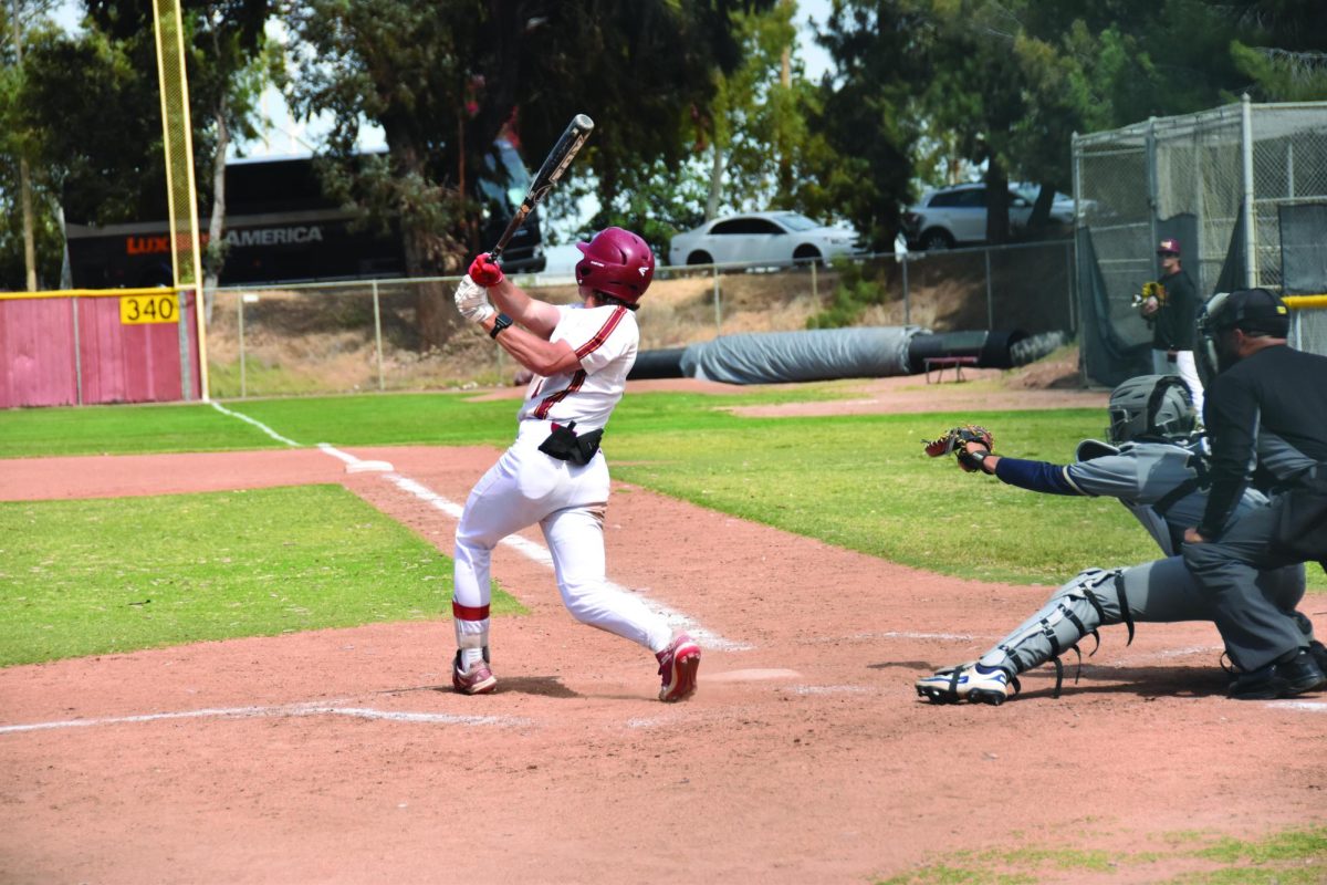 No. 9 Charlie Malton pops a fly ball into left field on April 15 at LMC.