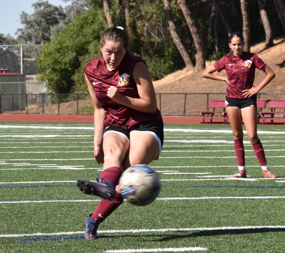 No. 7 Kelsey Imrisek-Kawalkowski takes a successful penalty kick during LMC's game against San Joaquin Delta College yesterday. She scored header during the first half, taking home two goals for LMC all told.