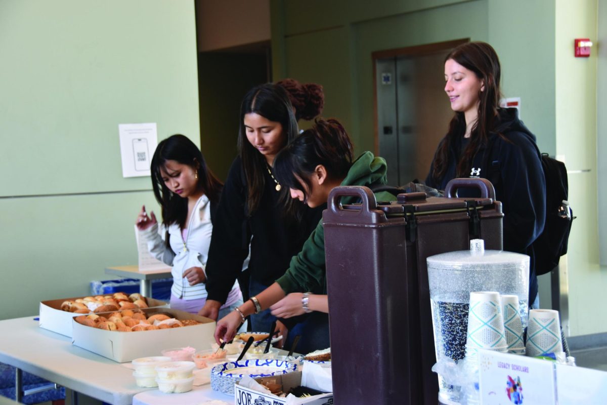 Students stop by for snacks during the Bagel & Coffee event.
