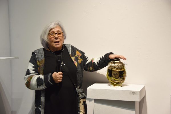 Marsha Mees speaks on her piece, "Rebirth" at the opening ceremony for the gallery Nov. 13.