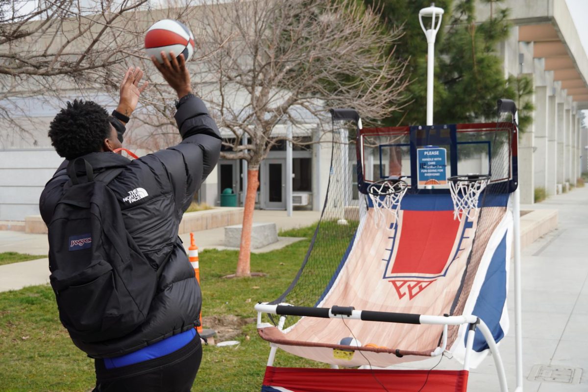 Student Vante Jones shoots a bucket at LMC Student Life's Black History Month Kickoff event Feb. 3.