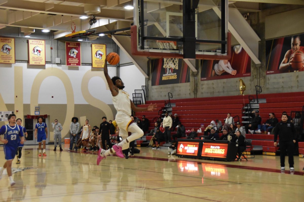 LMC's No. 1 Jeremiah Collins jumps to dunk the ball during LMC's game Feb. 17.