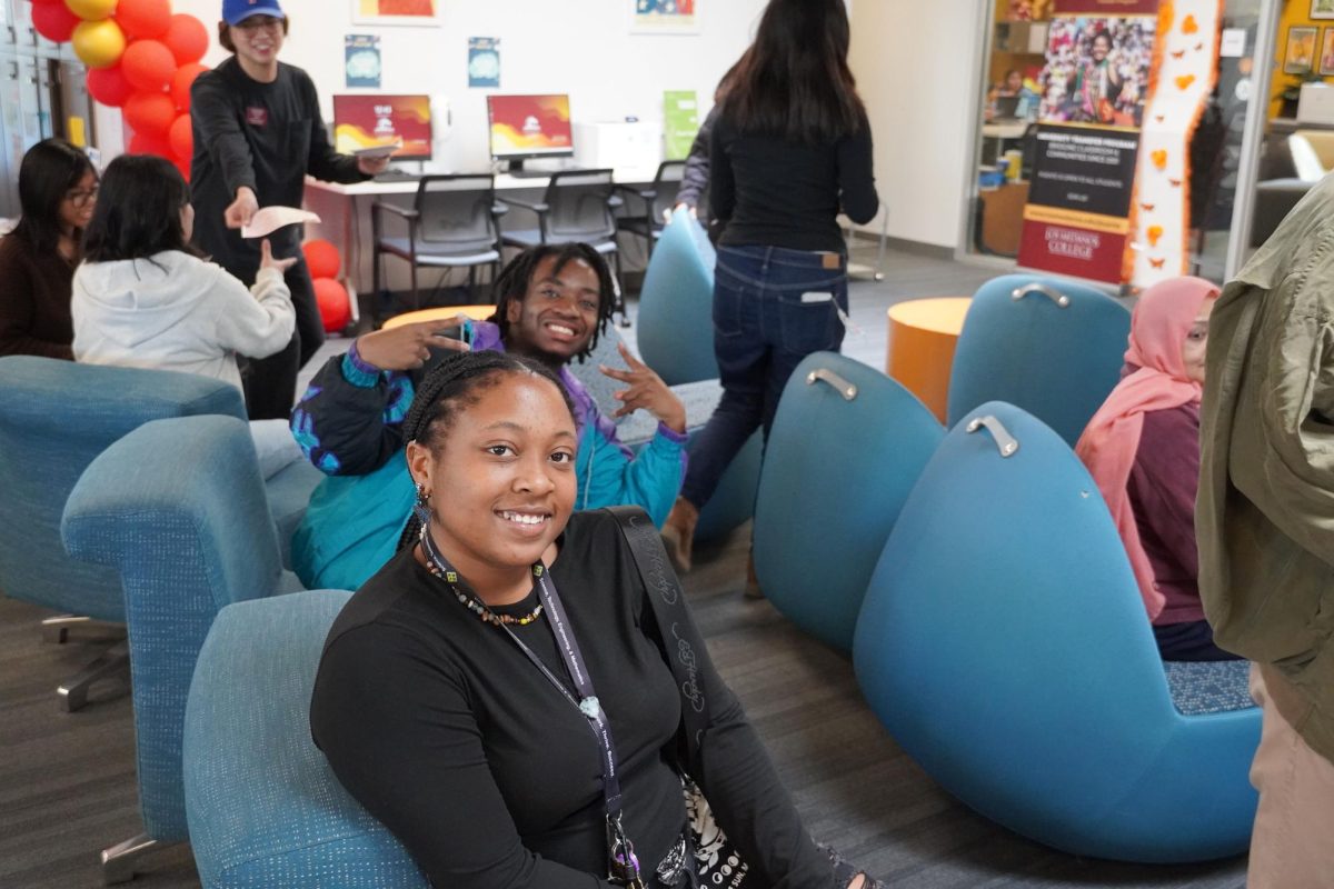 LMC students Naima Tillery and Aaron Clark smile for the camera at the DEIB mixer on Feb. 5th in the Student Union Lounge in the Student Union building 