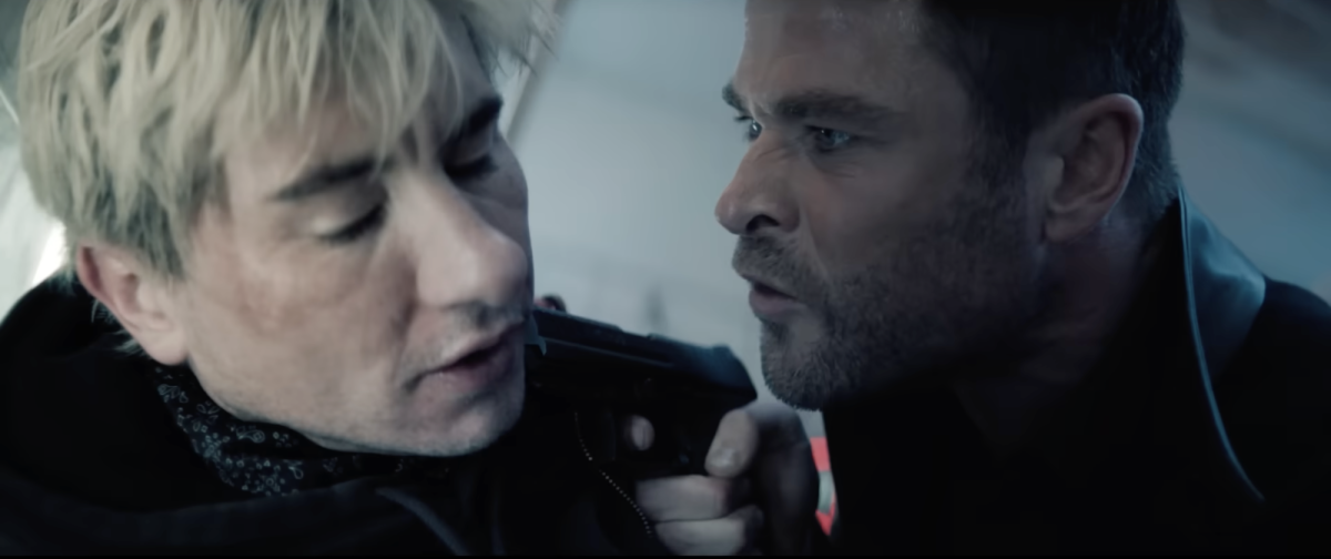 Screenshot from Amazon MGM Studios YouTube trailer shows Mike Davis holding a gun to Ormon in "Crime 101."