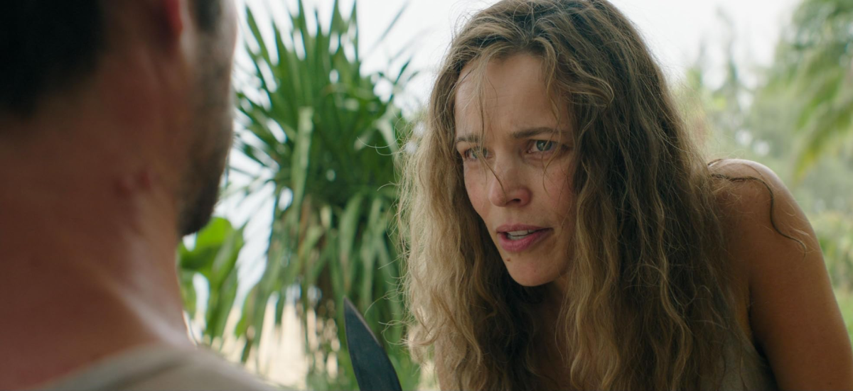Linda Liddle played by Rachel McAdams threatening Bradley Preston played by Dylan O'Brien with a knife.