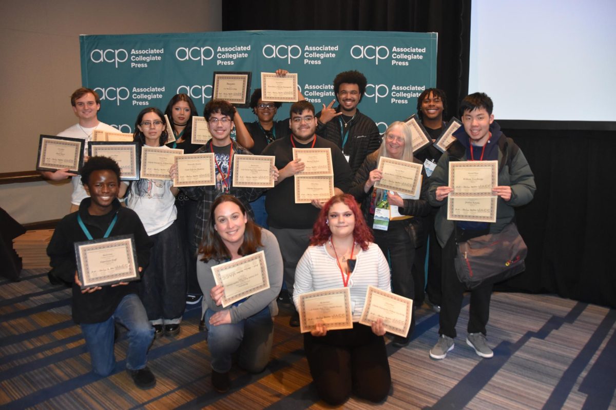 Experience staff shows their awards at the 2026 JACC Convention.