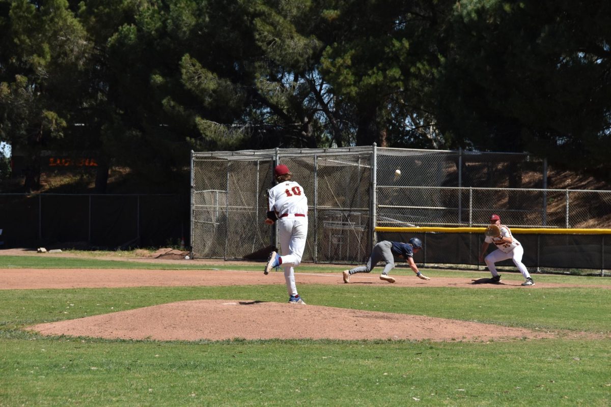 LMC Pitcher No/ 10 Cole Ehrhorn throws to No. 35 first baseman Brendan Lister to tag a Yuba College baserunner out in the April 3 game.