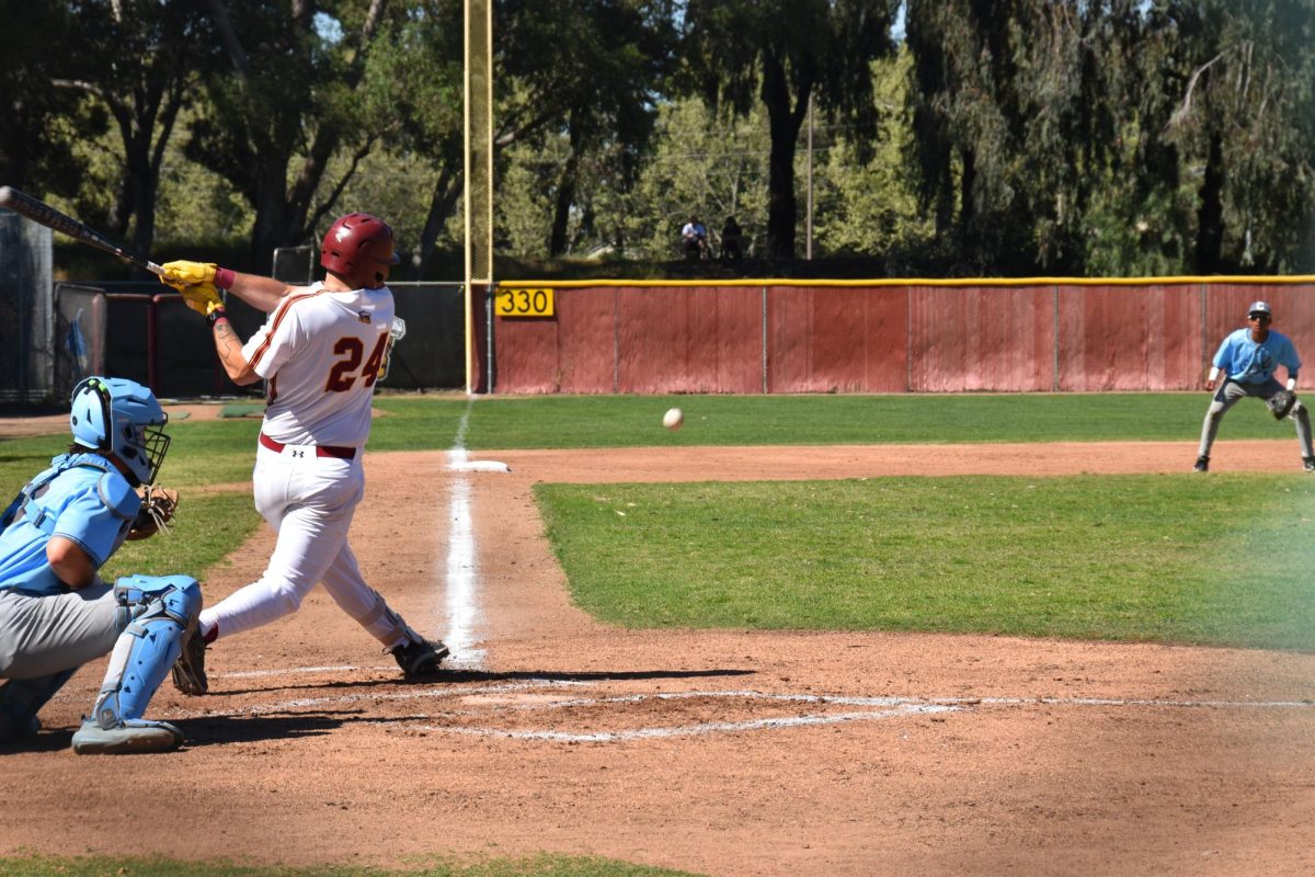 LMC player no. 24 Antonio Moriera hits a line drive down the third base line during LMC's game against Contra Costa College Mar. 17.