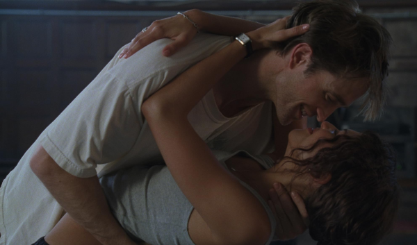Main characters in "The Drama" share an intimate moment.
