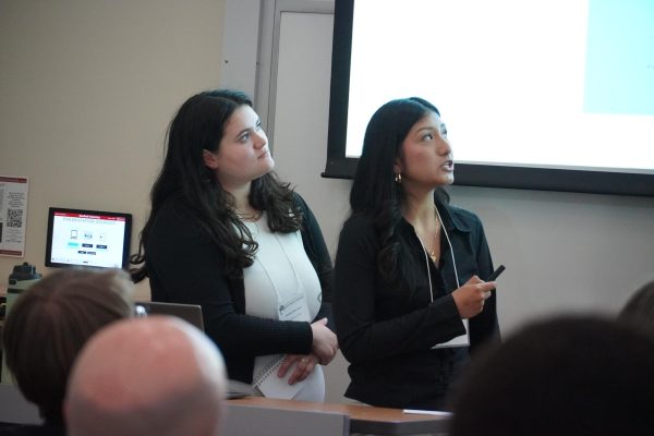 Natalya Marroquin and Valerie Macha Ramos present at the Honors Research Symposium at Stanford University.