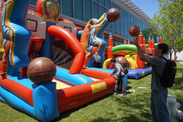LMC student Alex Pikula shoots a basketball at the Transfer Celebration in the Outdoor Quad of the Pittsburg campus.