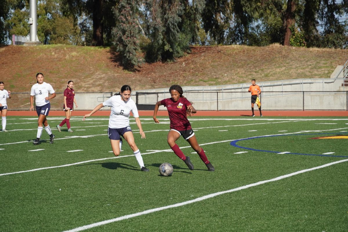 No. 12 Elyse Baldwin beats a defender during the first half of a game against Contra Costa College Nov. 4.